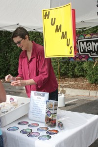 Linda Conrad offering samples at the Saturday Farmers Market.