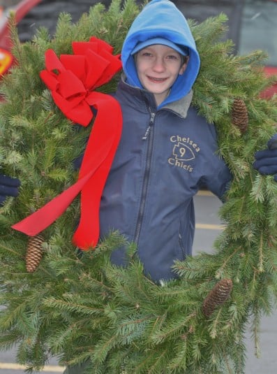 File photo. A scout draped in a wreath.