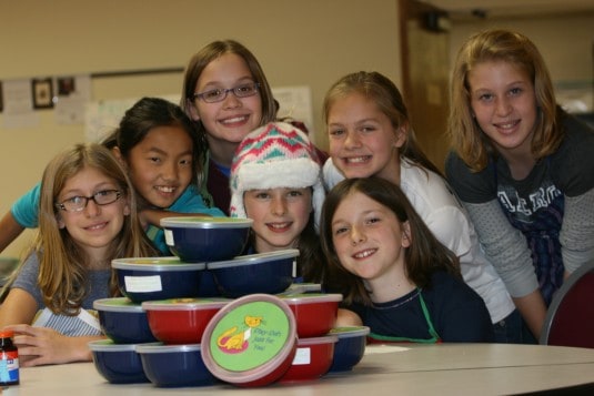 Courtesy photo. Members of Girl Scout Troop 40211 (and friends) give back to the community.