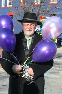File photo. Bob Pierce, executive director of the Chelsea Chamber of Commerce, arrives with balloons for the first business leadership winner. 