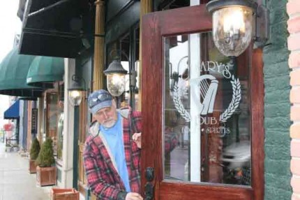 Glenn Blaine of Grass Lake works on the new front door at Cleary's Pub.