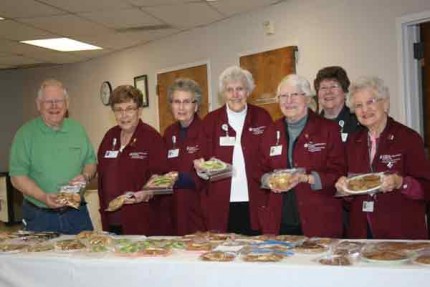 A group of hospital volunteers display just a few of the basked goodies that were for sale Thursday at Chelsea Community Hospital.