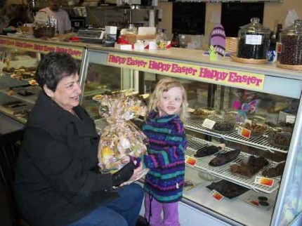 Chelsea resident xxx receives her basket from Ellie Radant after the drawing at Ellie's Chocolate Cafe.