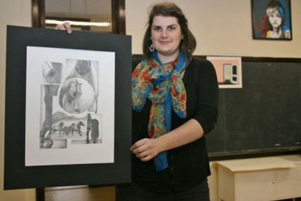 Geo Rutherford, student art teacher at the high school holds one of her student's drawings. 