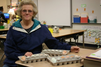 Linda Reilly of Clear Creek Farm with three dozen chicken eggs.