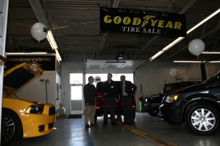 Inside the garage area at Village Motor Sales with a trio of new cars during a Chelsea Area Chamber of Commerce after hours event Thursday night. 