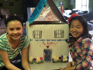 Courtesy photo. Brianna Hay and Kira Frahm show off the collection box for the housewarming kit for an 18-year-old leaving Methodist Children's Home this spring.