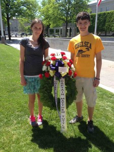 Mekenzie Konschuh and Ben Ingall with the wreath 8th-graders presented. 
