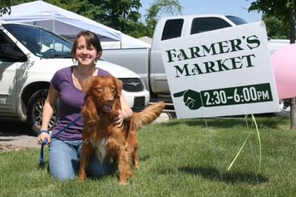In case you've missed it, Driver, one of my three dogs, has been frequenting the Bushel Basket Farmers' Market on Wednesdays. He's pictured here with Market Manager Ashley Miller-Helmholdt.