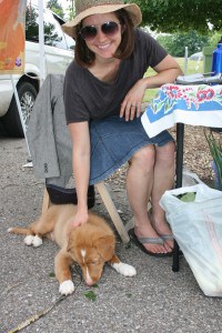 Buzz, the mascot-in-training with market manager Ashley Miller Humboldt.