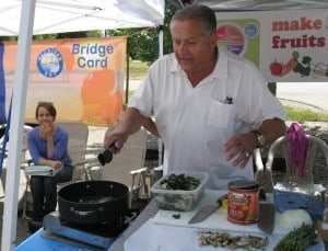 Courtesy photo by Susan Gartner of Peter di Lorenzi cooking at the Bushel Basket Farmers' Market on July 24.