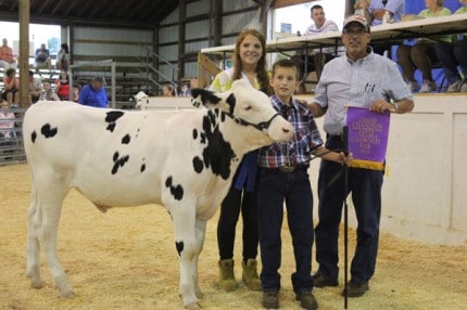 Darren Bollinger and his grand champion feeder calf. 