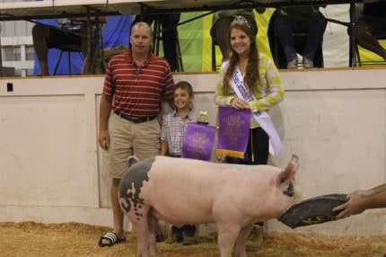 Jack McCalla and his grand champion pig. 
