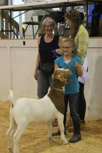 Kierstin Norris and her reserve grand champion goat that sold for $275 to the Pittsfield Grange.