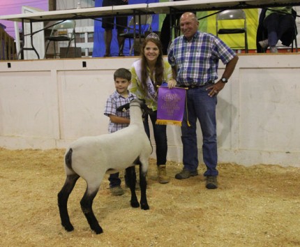 Tanner Trinkle with his grand champion lamb.