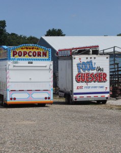 Who wants popcorn? More midway trailers arrive at the Chelsea Community fairgrounds.