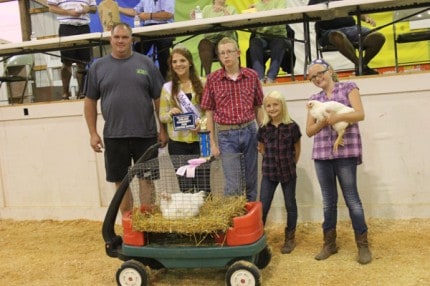 Mike and Kristine O'Day took reserve champion meat pen chickens, which were bought for $300 by the Blast Corn Maze.