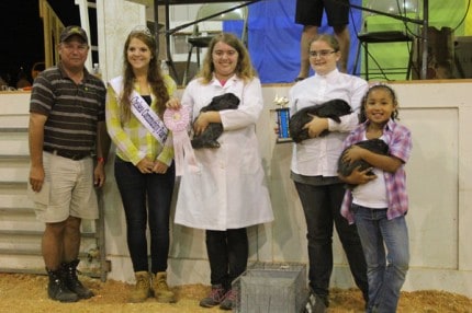 Samantha Bellairs won reserve champion meat pen rabbit and they sold for $300 to Staffan Mitchell Funeral Home. 