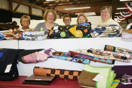 Superintendents and volunteers from machine sewing, quilts and needlework.