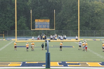 Frosh and JV run formations in the rain Monday morning.  