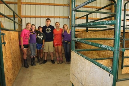 Some of the equestrians who will participate at fair are pictured here after setting up the horse and pony stalls at the fairgrounds.