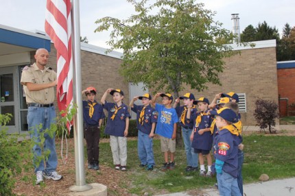 Saluting and learning about how to raise and lower the flag. 