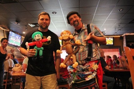 Labor Day at Jet's pizza. Jason Povich and John Charlton pose for a photo with individually made balloon designs inside the packed dining room.