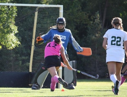 Courtesy photo by xxx. Kristen Newman whips ball into the net. 