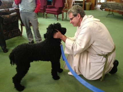 Courtesy photo. Rev. xxx blesses xxxx.