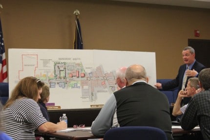 City Manager John Hanifan shows DDA members what plans have been completed in the group's long-range plans.