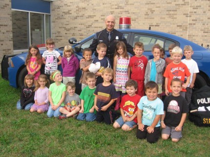 Courtesy photo. Debra Boham's kindergarten class poses for a photo with a Michigan State trooper.