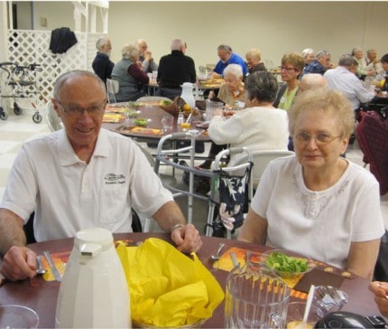 Don and Linda Cole enjoy Thanksgiving lunch at the Chelsea Senior Center. The Cole Family sponsors the annual event.