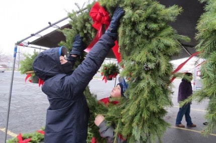File photo. Patrick Quinn displays holiday greens for Chelsea Boy Scout Troop 425's Holiday Green Sale.