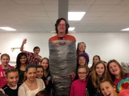 Teacher Scot Reidel was the first of three teachers to be duct taped to a pole during a fundraiser for Avalon Housing on Friday at Beach Middle School.