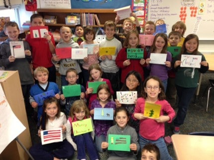 Courtesy photo. Members of Gwen Stubb's class at South Meadows Elementary and the cards they made for our troops and veterans.