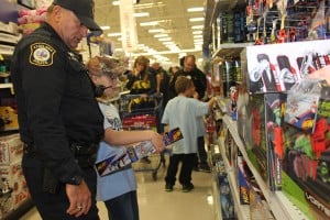 Chelsea Police Officer Rick Cornell and his buddy during Shop with a Cop.