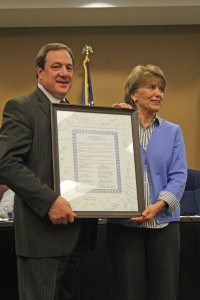 Chelsea Mayor Jason Lindauer and Joanne Ladio with the signed and framed proclamation of Equality.