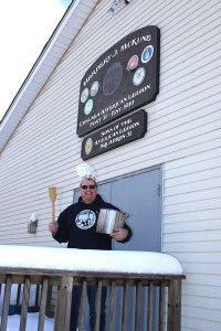 Larry Doll, chairman of the chili cook off poses with pot and spoon outside the American Legion Post. 