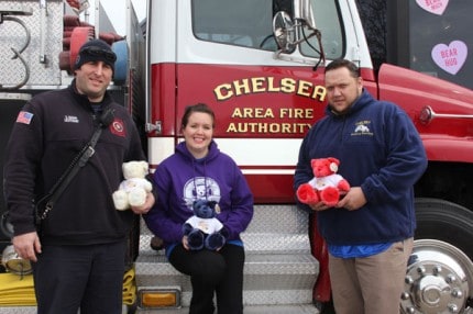 Scott Basar, Murphy Payeur and Ed Greenleaf hold the special edition teddy bears for Saturday's Firefighters Bowling Bash.