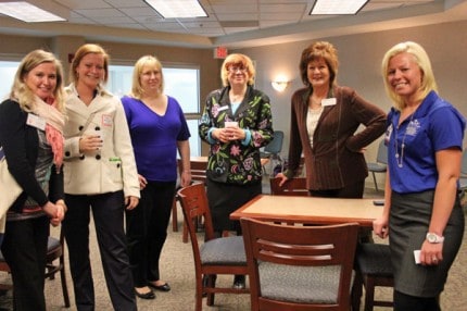 Chamber members and chelsea Wellness Center staff pose for a photo.