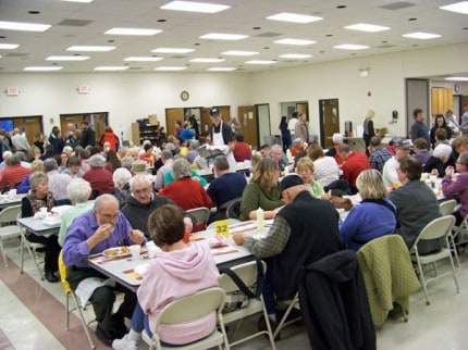 Photo by Ross Richardson. The community seated for the annual fish fry at St. Mary Catholic Church. 