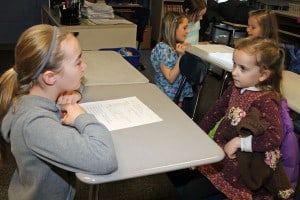 Sixth graders ad kindergarteners get to know one another. 