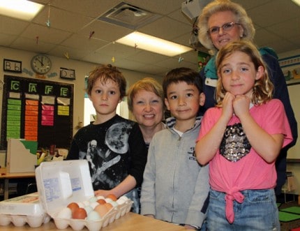 First grade students in Karen Glover's class, Glover and Lyndon Township farmer Linda Reilly with the eggs that will be part of their classroom for the next month or so. 