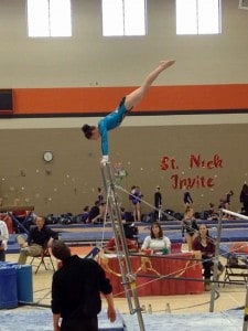 Courtesy photo. Savannah Fisk competes on bars at an earlier competition. 