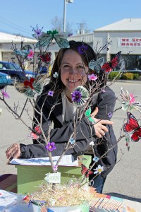Market Manager Ashley Miller Helmholdt and the money tree.