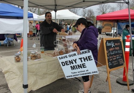Deny the Mine signs were popular purchases at Saturday's Chelsea Farmers' Market.