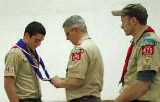 Courtesy photo. David J. Trimas (left) receiving his Eagle Scout neckerchief and pin. Also pictured are Troop Committee Chairman Michael Dailey and Scoutmaster David Stahl.