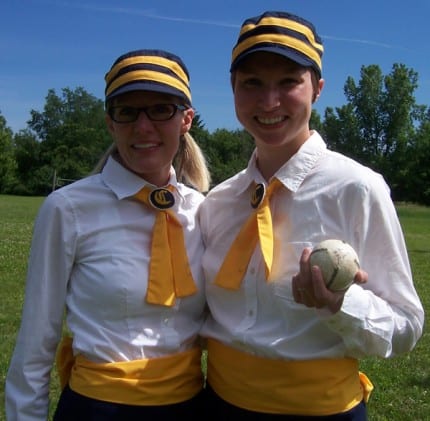 The ladies get ready to play vintage base ball. 