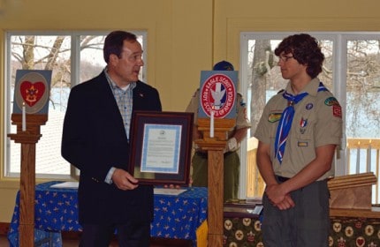 Photo by Chuck Reed. Chelsea Mayor Jason Lindauer presents Eagle Scout Tyler Lubinski was a proclamation from the city during his Court of Honor ceremony. 