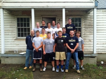 Another photo of members of the Chelsea High School football team who worked on the Habitat for Humanity home. 